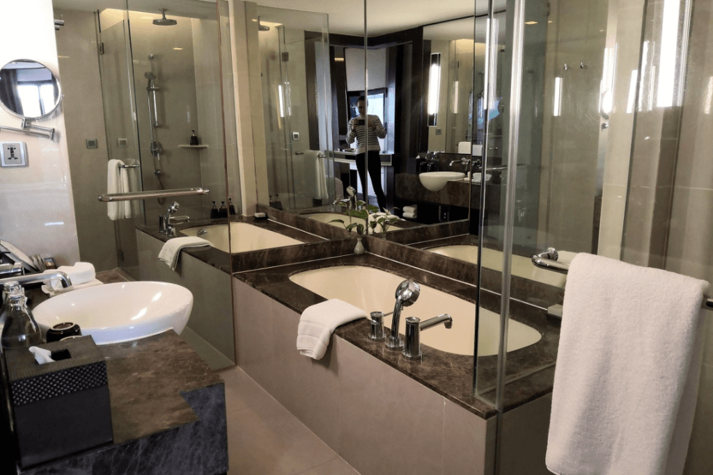 The mirror-clad bathroom of the deluxe river view room