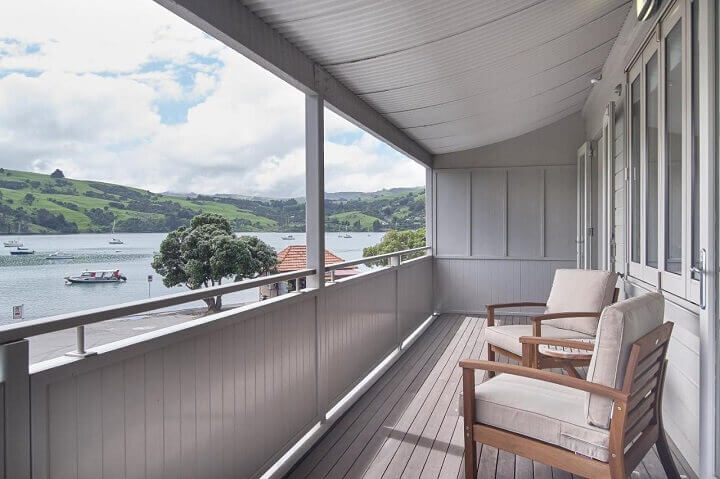 A large balcony with harbour views at Akaroa Village Inn