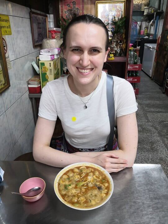 Ksenia enjoying her tom yum soup at one of the many eateries along Maha Rat Road