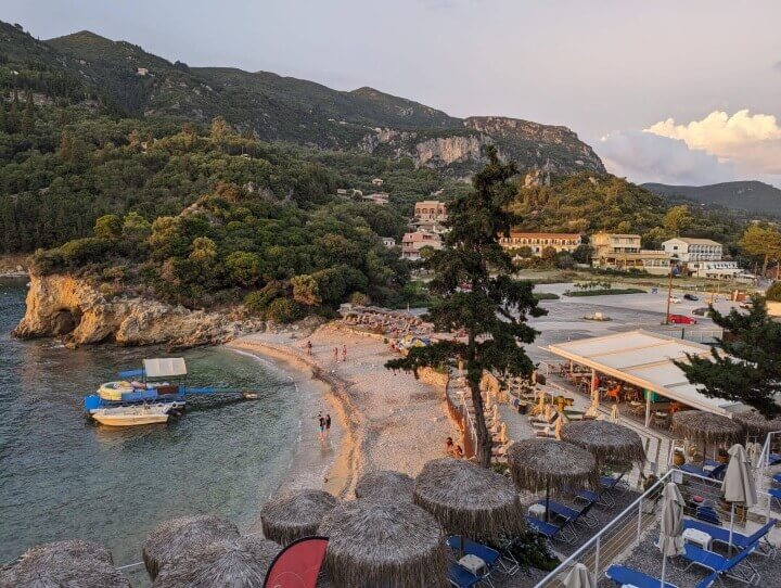 Corfu Town to Paleokastritsa Hero Shot - a sunset a a beautiful Paleokastritsa beach