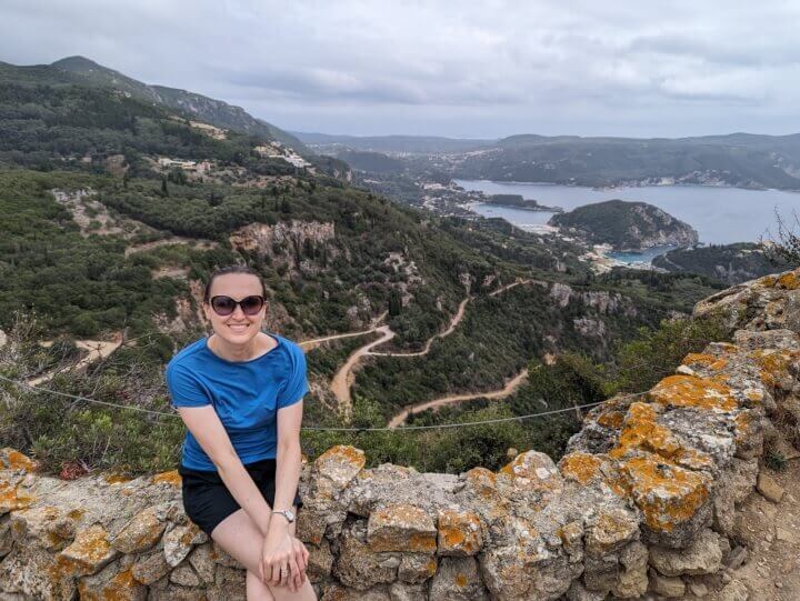 Ksenia enjoying the view over Paleokastritsa and beyond - landscapes like this is one of the many reasons why Corfu is worth visiting