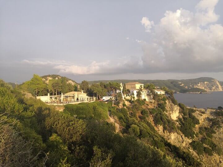 The view of Monastre, one of the best restaurants in Paleokastritsa, located right next to the historic Paleokastritsa Monastery.
