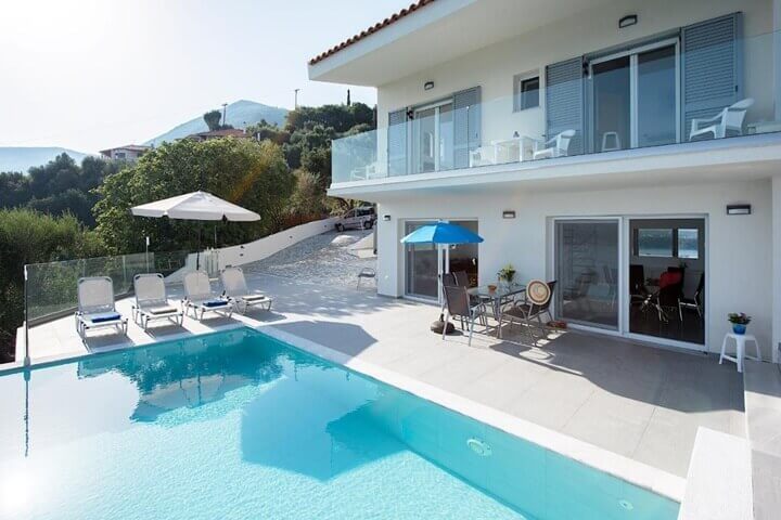 The pool and sun loungers at N&L Villas in Pyrgi, Corfu