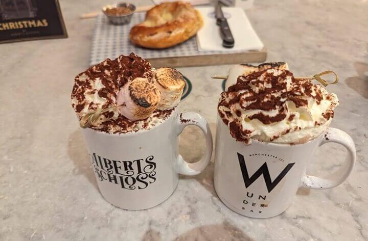Hot Chocolates from Albert's Schloss in Manchester city centre. The hot chocolates are topped with whipped cream, chocolate powder and marshmallows.