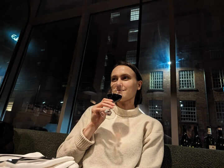 Ksenia enjoying a glass of red wine on a night out at Erst
