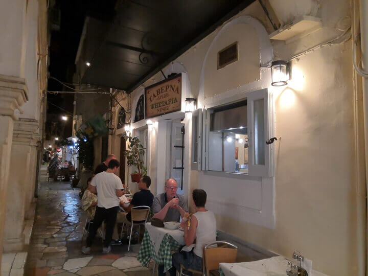 The entrance to Ninos Taverna at night-time