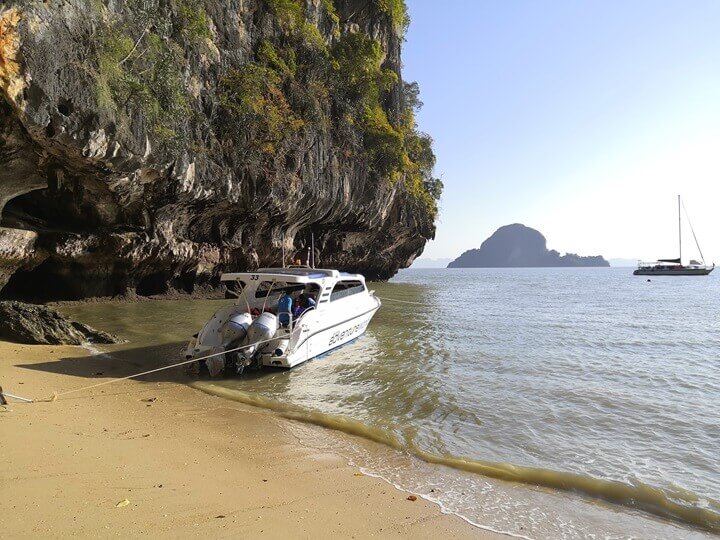A small boat on a Thai beach